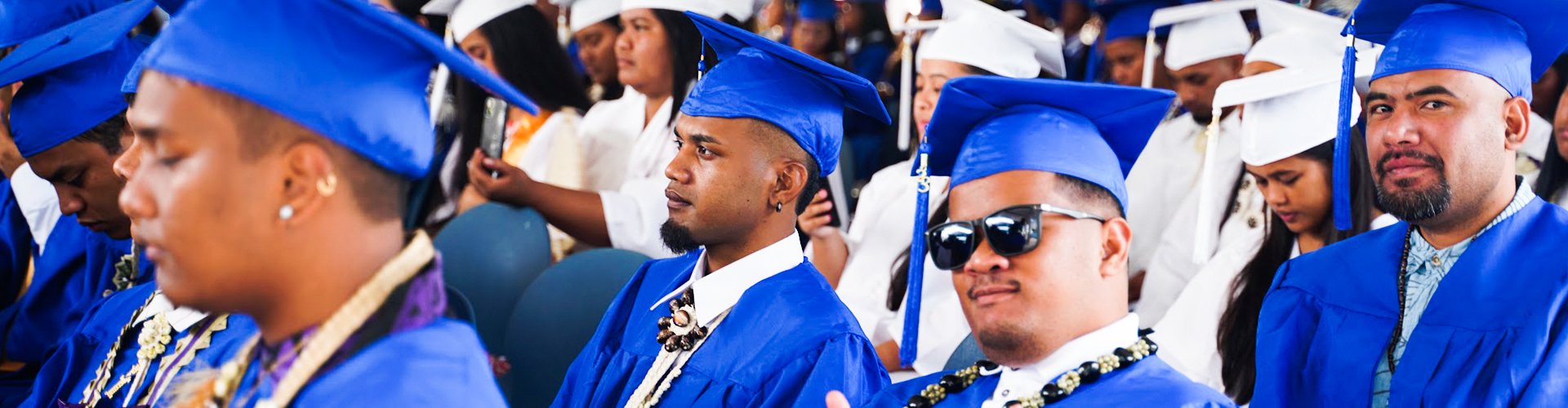 Students laughing and working together on campus