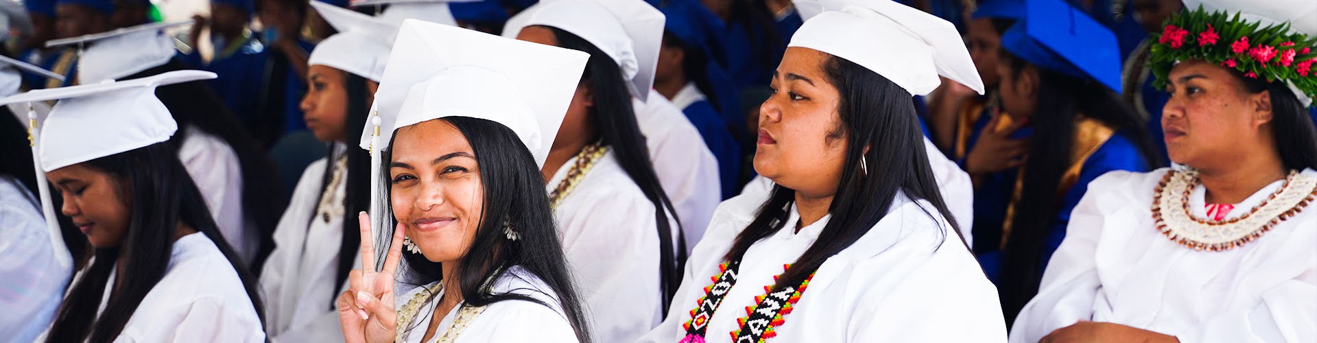 Students working in campus library computer room