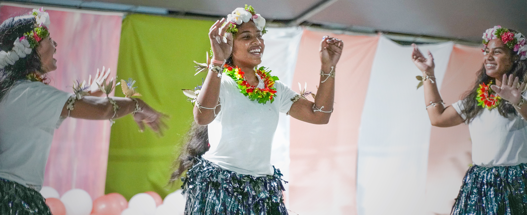 Students laughing and working together on campus